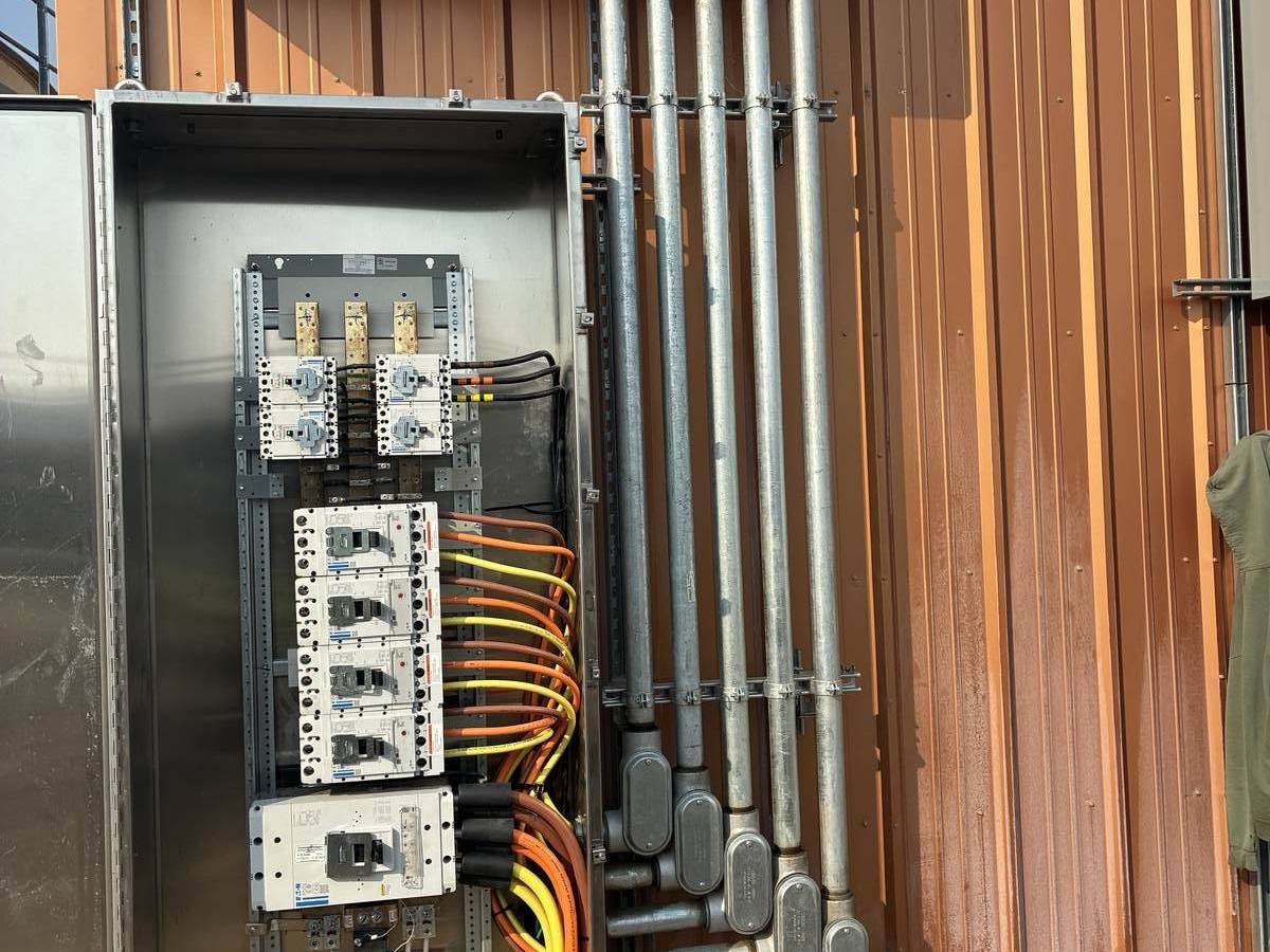 Outdoor panelboard with neat conduit and LB fittings